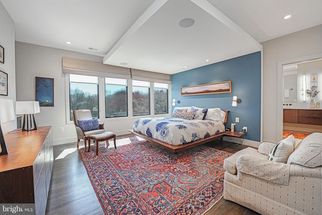 bedroom featuring visible vents, ensuite bathroom, wood finished floors, recessed lighting, and baseboards