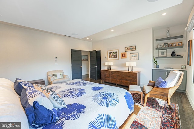 bedroom with visible vents, recessed lighting, baseboards, and wood finished floors