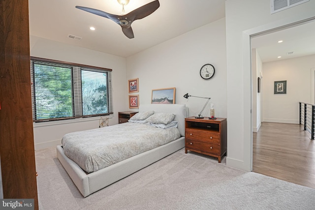 carpeted bedroom with recessed lighting, visible vents, baseboards, and ceiling fan