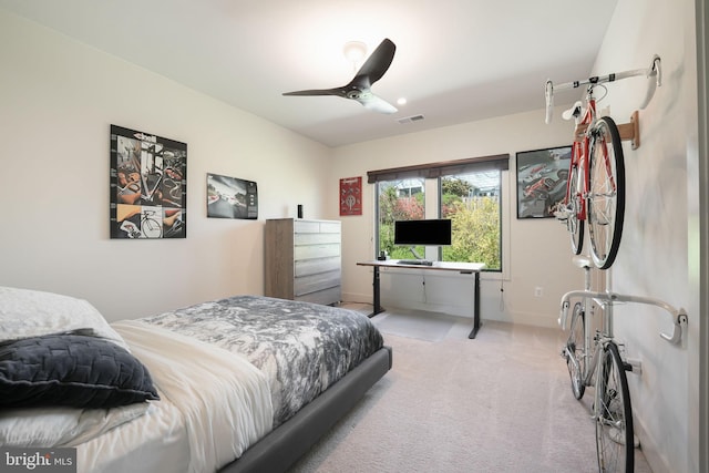 carpeted bedroom featuring ceiling fan