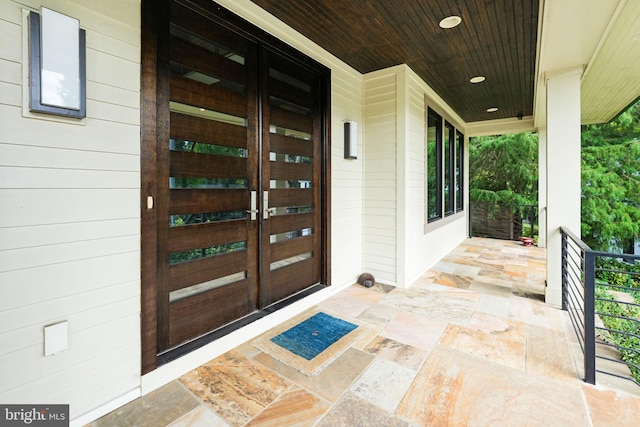 property entrance with covered porch