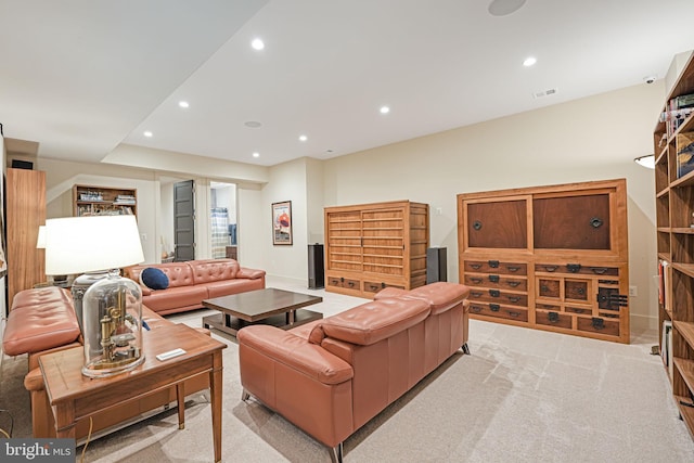 living room featuring light colored carpet, recessed lighting, visible vents, and baseboards