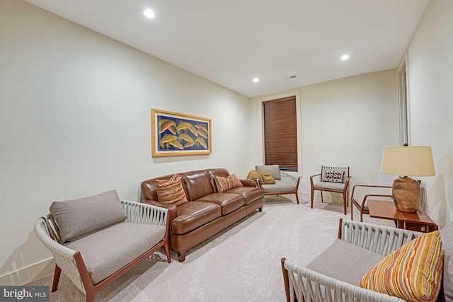 living room with recessed lighting, visible vents, baseboards, and carpet