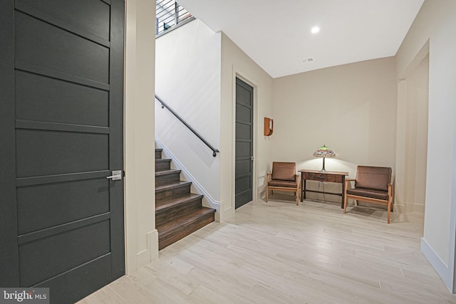 foyer entrance with light hardwood / wood-style flooring