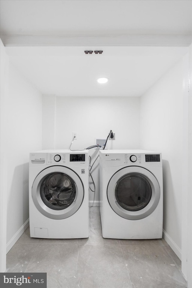 laundry area with washer and clothes dryer