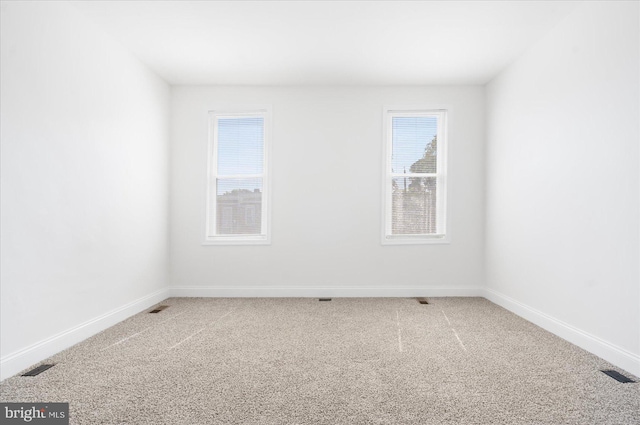 spare room with carpet floors