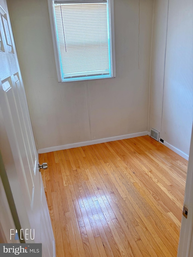 unfurnished room with light hardwood / wood-style flooring