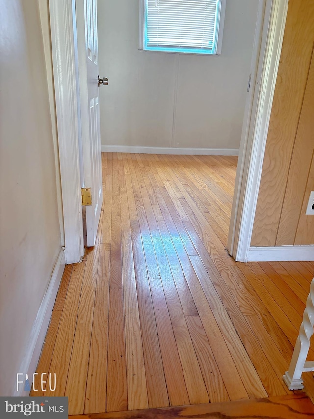 hall with light hardwood / wood-style flooring