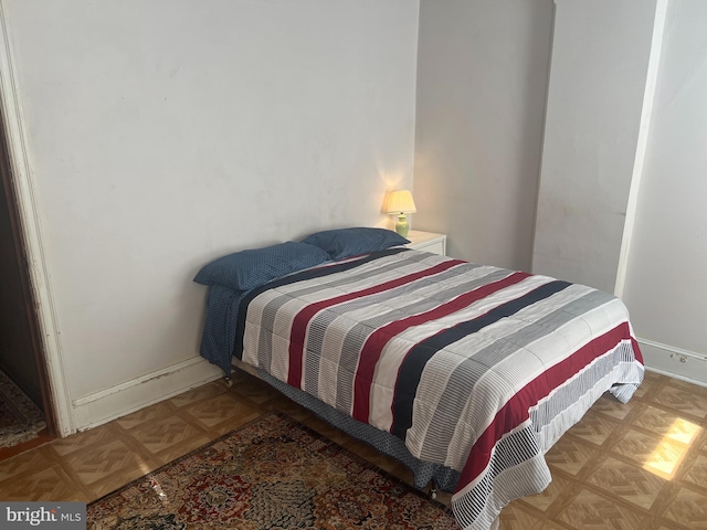 bedroom featuring light parquet floors