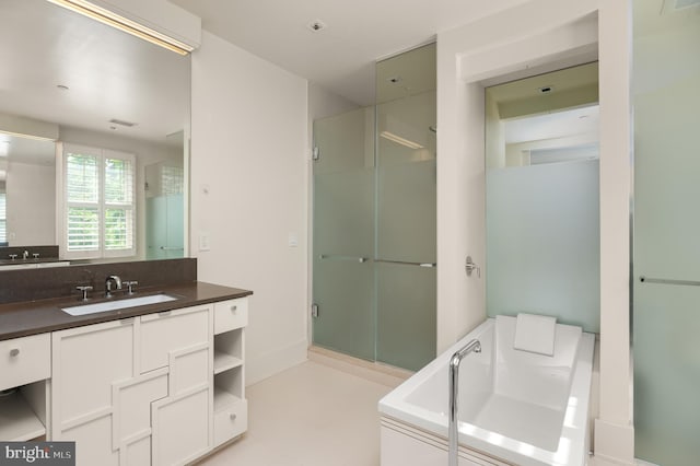 bathroom featuring vanity and an enclosed shower