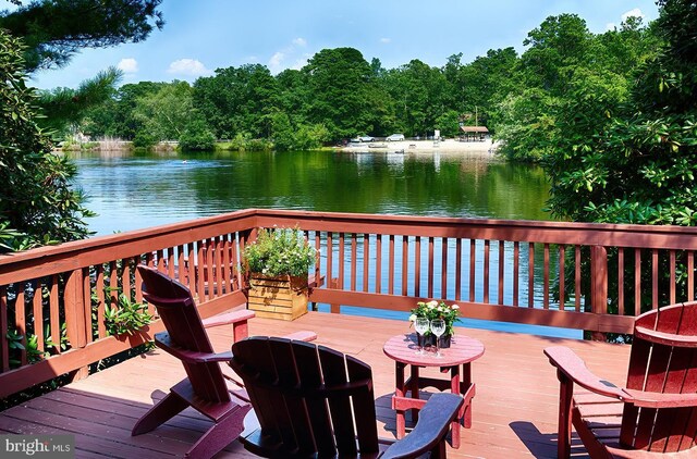 wooden terrace with a water view