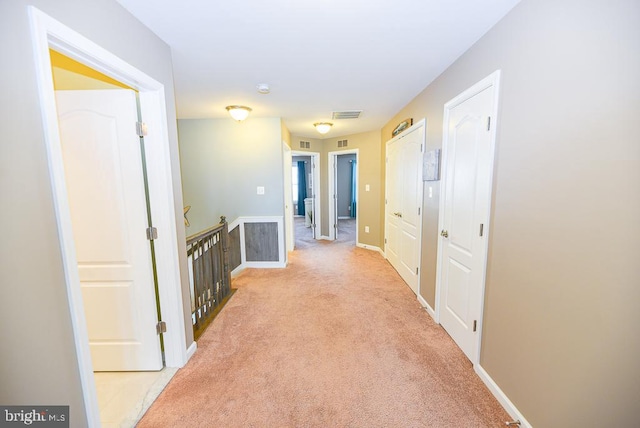 corridor with light carpet