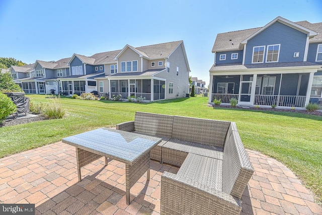 view of patio / terrace with a sunroom