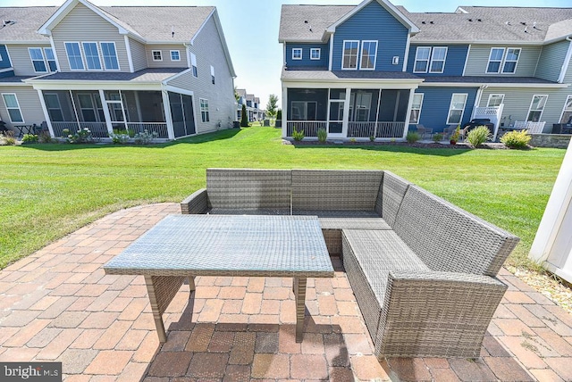 view of patio featuring a sunroom