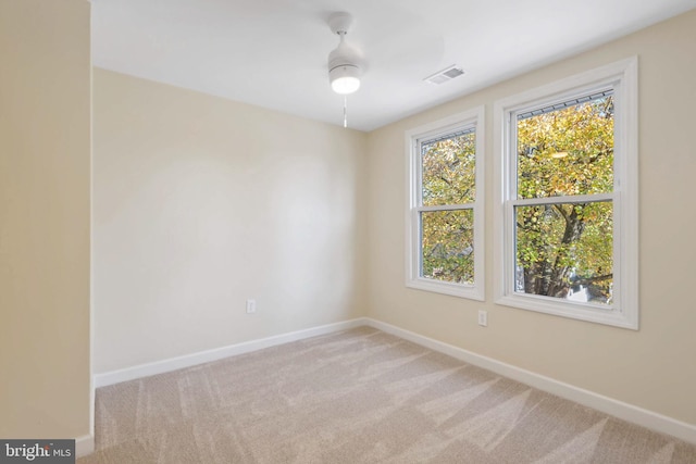 empty room featuring light colored carpet