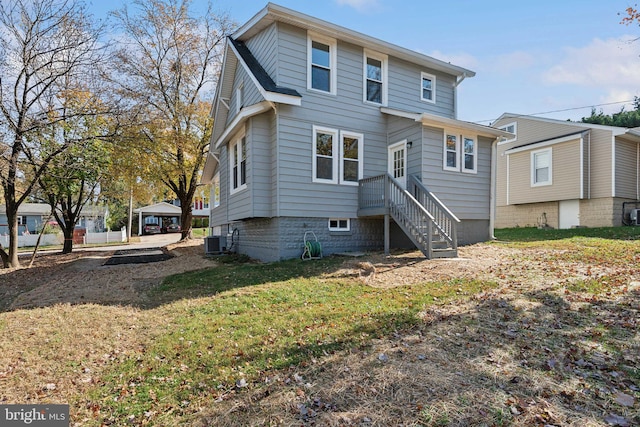 back of house featuring central AC