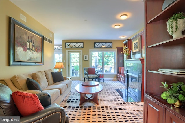 living room featuring a fireplace