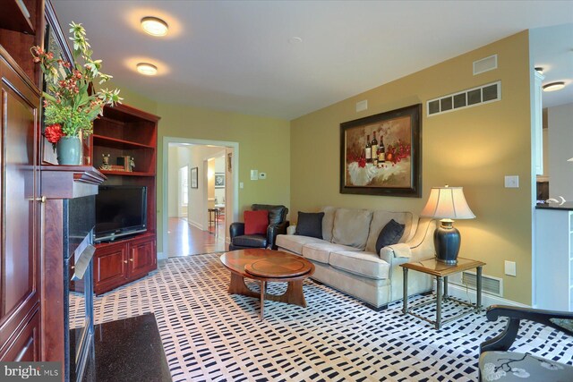 living room featuring a fireplace