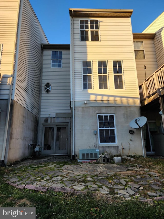 rear view of property with french doors