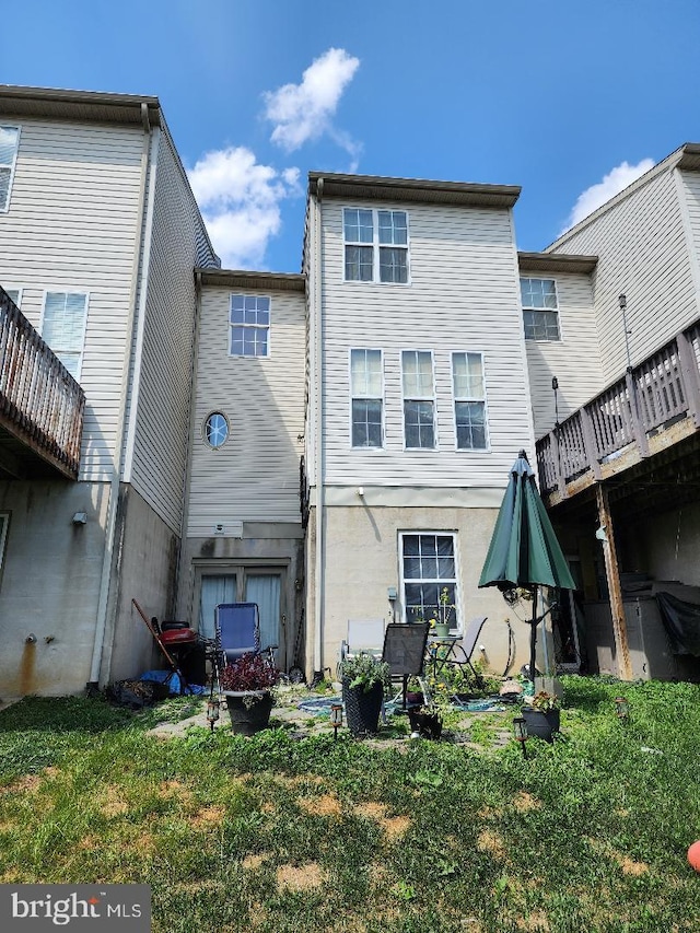 rear view of house with a lawn