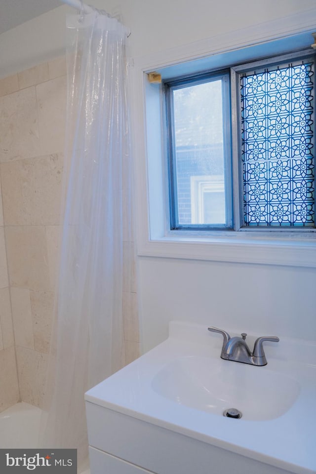 bathroom with vanity and shower / bathtub combination with curtain