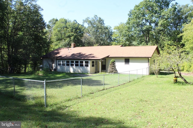 ranch-style house with a front yard