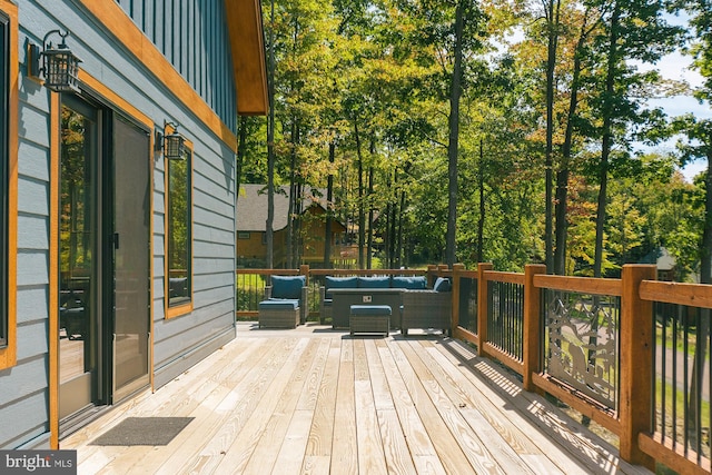 wooden terrace with outdoor lounge area