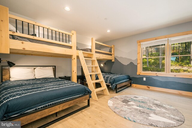 bedroom with hardwood / wood-style floors