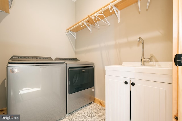 laundry room with cabinets and washing machine and dryer