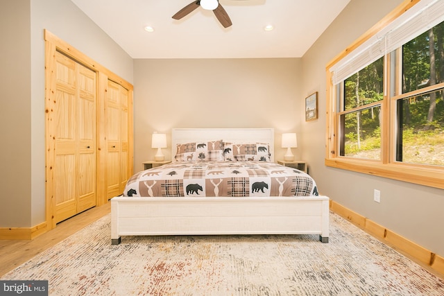 bedroom featuring wood-type flooring and ceiling fan