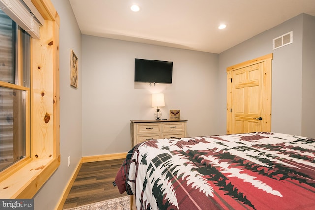 bedroom featuring dark hardwood / wood-style floors