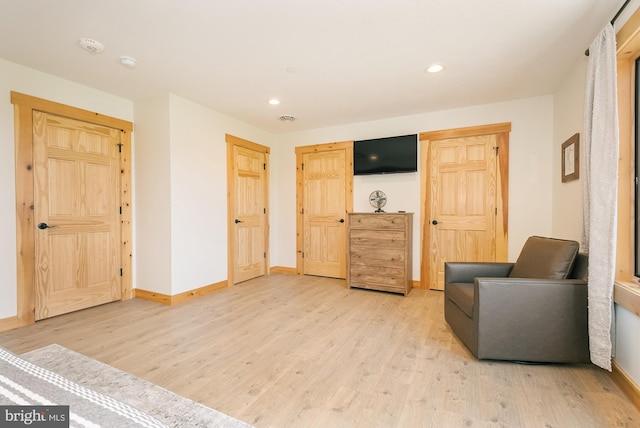 sitting room with light hardwood / wood-style floors