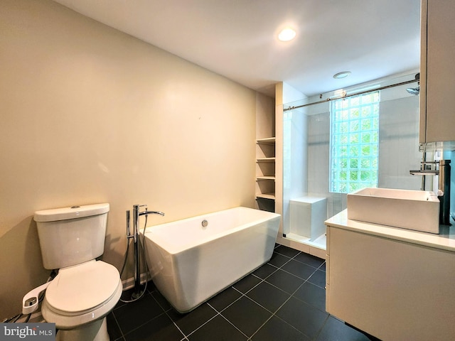 full bathroom featuring tile patterned flooring, vanity, toilet, and shower with separate bathtub