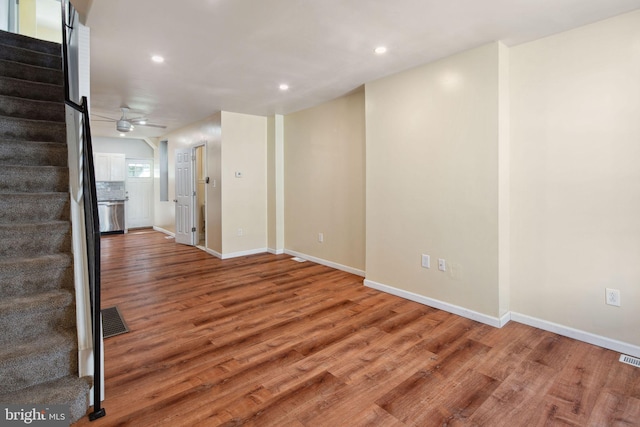 spare room with ceiling fan and hardwood / wood-style flooring