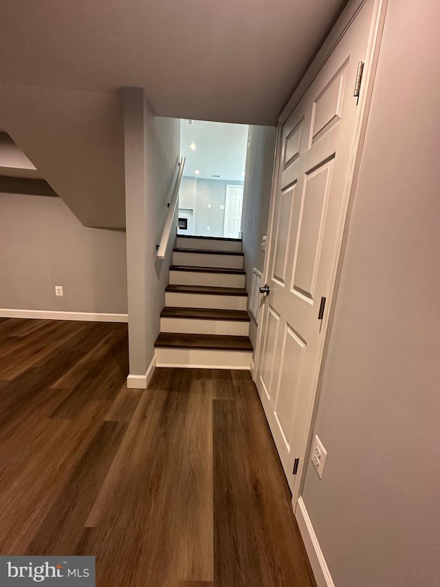 staircase featuring hardwood / wood-style floors