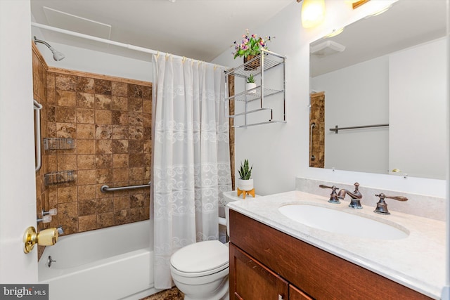 full bath with vanity, shower / tub combo, and toilet