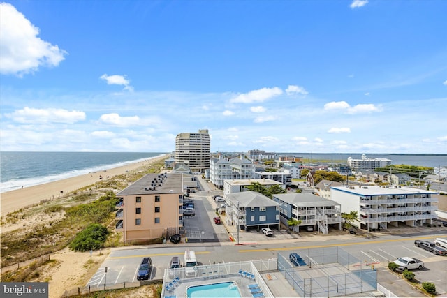 birds eye view of property featuring a view of the beach and a water view