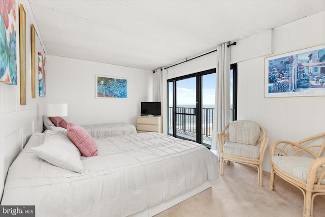 carpeted bedroom featuring access to outside