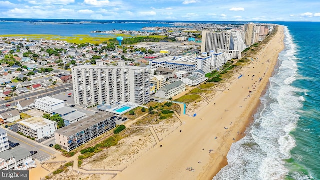 bird's eye view featuring a beach view and a water view