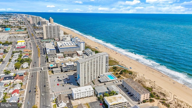 aerial view featuring a view of the beach and a water view