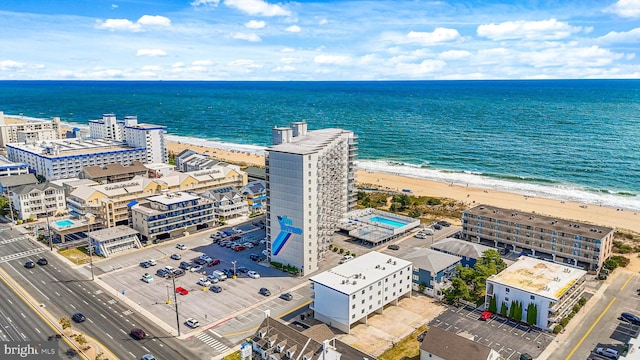 aerial view featuring a view of the beach and a water view