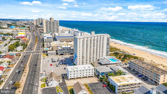 birds eye view of property with a city view, a beach view, and a water view