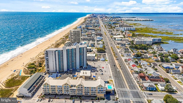 aerial view with a water view and a view of the beach