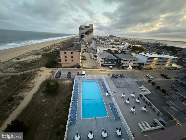 drone / aerial view featuring a view of the beach and a water view