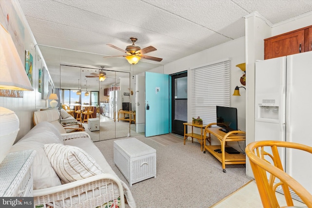 living room with ceiling fan and light wood-type flooring