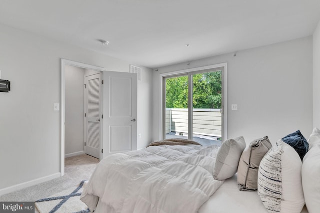 bedroom featuring light carpet