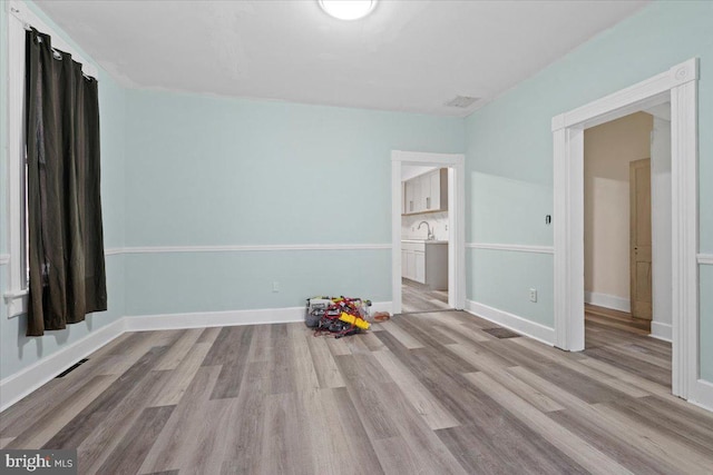 unfurnished bedroom with light hardwood / wood-style flooring