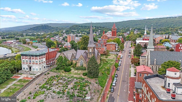 drone / aerial view featuring a mountain view