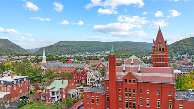 birds eye view of property with a mountain view