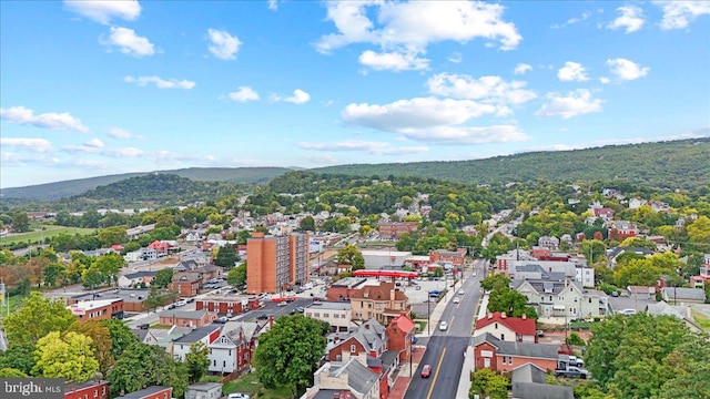 birds eye view of property with a mountain view